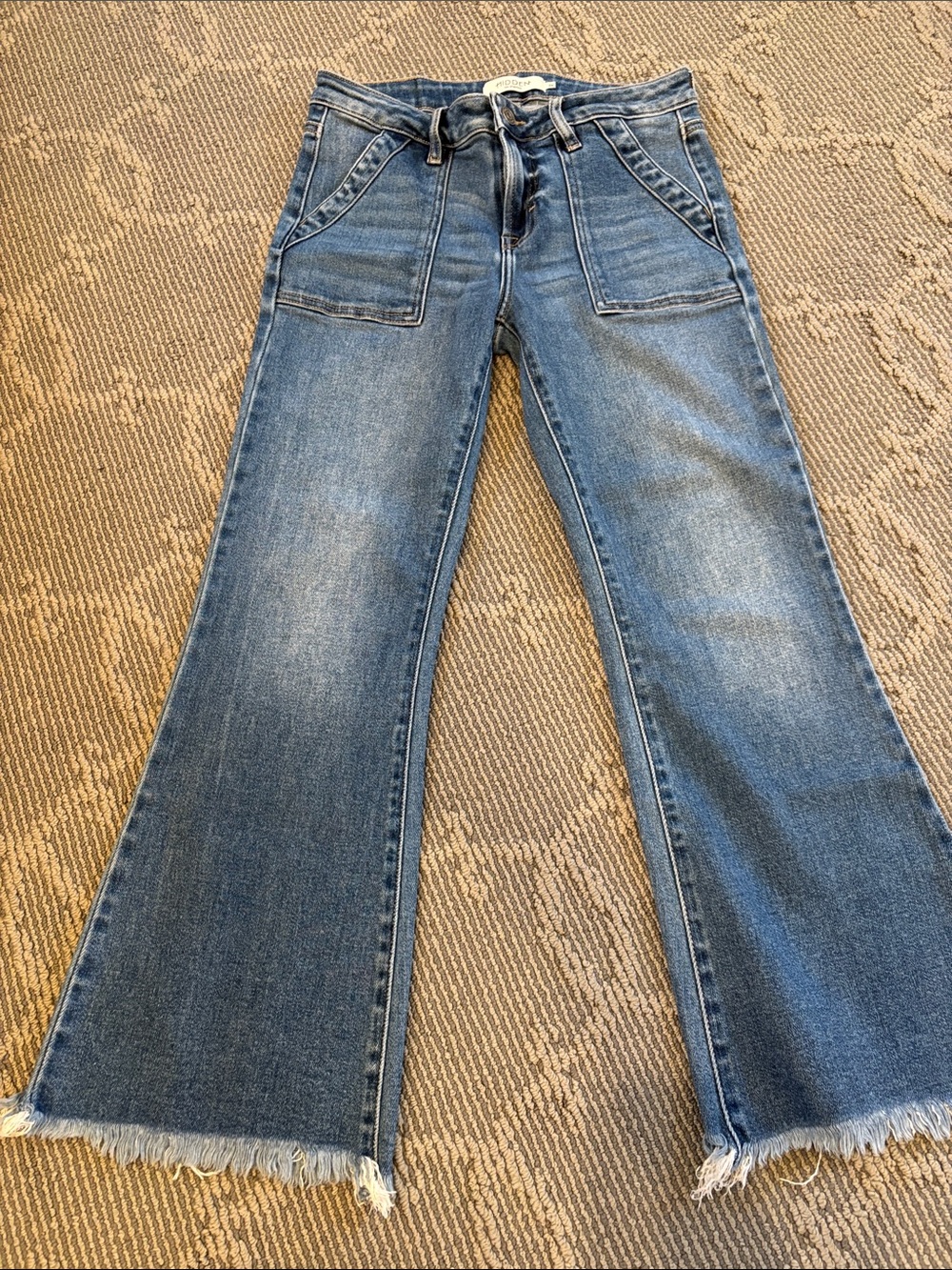 High-Rise Wide-Leg Flare Jeans in Medium Blue with Raw Hem
